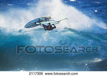 Hawaii, Maui, Ho'okipa, Professional windsurfer Kauli Seadi carves a powerful turn on a wave. EDITORIAL USE ONLY. View Large Photo Image Stock Photograph - Hawaii, Maui, Ho'okipa, Professional windsurfer Kauli Seadi carves a powerful turn on a wave. EDITORIAL USE ONLY.. Fotosearch