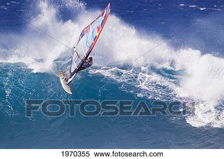 Stock Photography - Hawaii, Maui, Ho'okipa, Professional Windsurfer Jason Polakow Carves Powerful Turn On Wave. For Editorial Use Only.. Fotosearch
