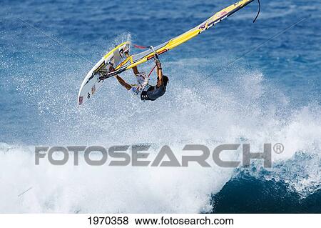 Hawaii, Maui, Ho'okipa, Windsurfer Catches Big Air Off Wave. For Editorial Use Only. View Large Photo Image Stock Photo - Hawaii, Maui, Ho'okipa, Windsurfer Catches Big Air Off Wave. For Editorial Use Only.. Fotosearch
