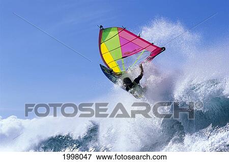 Stock Photo - Hawaii, Maui, Ho'okipa, Windsurfing Jason Prior Crashing Off Wave. Fotosearch