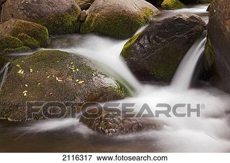 Hawaii, Maui, Iao River Valley, water in motion over rocks. View Large Photo Image Stock Photo - Hawaii, Maui, Iao River Valley, water in motion over rocks.. Fotosearch