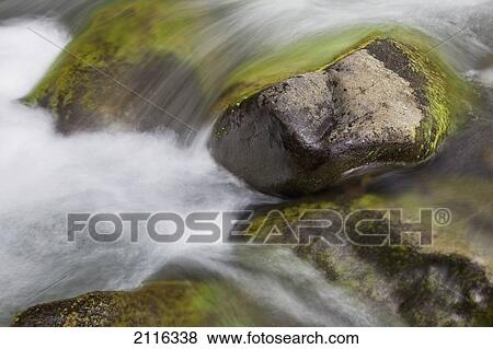 Stock Photo - Hawaii, Maui, Iao Valley, A close up of colorful river rocks under water.. Fotosearch