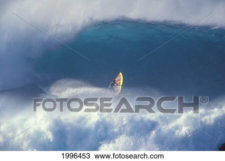Stock Image - Hawaii, Maui, Jason Polakow In Midst Of Huge Crashing Waves, One Curls Above, Action. Fotosearch