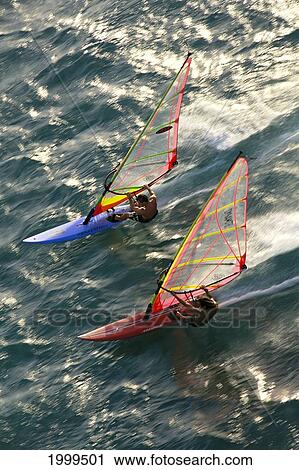 Hawaii, Maui, Kanaha, Aerial View Of Two Men Cutting Through Golden Water, Blur Action View Large Photo Image Stock Image - Hawaii, Maui, Kanaha, Aerial View Of Two Men Cutting Through Golden Water, Blur Action. Fotosearch