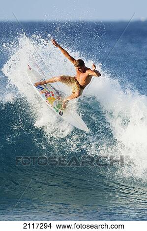 Picture - Hawaii, Maui, Kapalua, Professional surfer Albee Layer carves a powerful turn. EDITORIAL USE ONLY.. Fotosearch