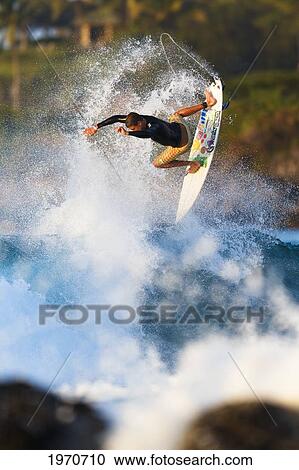 Hawaii, Maui, Kapalua, Professional Surfer Albee Layer Catches Air Off A Wave. For Editorial Use Only. View Large Photo Image Stock Image - Hawaii, Maui, Kapalua, Professional Surfer Albee Layer Catches Air Off A Wave. For Editorial Use Only.. Fotosearch