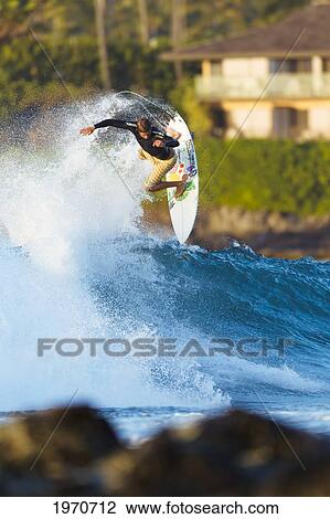 Hawaii, Maui, Kapalua, Professional Surfer Albee Layer Catches Air Off A Wave. For Editorial Use Only. View Large Photo Image Stock Image - Hawaii, Maui, Kapalua, Professional Surfer Albee Layer Catches Air Off A Wave. For Editorial Use Only.. Fotosearch