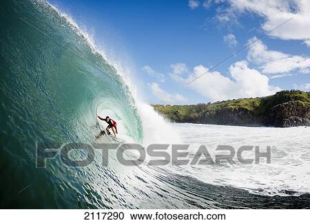 Stock Image - Hawaii, Maui, Kapalua, Professional surfer Eric Totah rides a wave at Honolua Bay. EDITORIAL USE ONLY.. Fotosearch