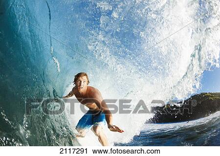 Stock Image - Hawaii, Maui, Kapalua, Professional surfer Kevin Sullivan rides a wave at Honolua Bay. EDITORIAL USE ONLY.. Fotosearch