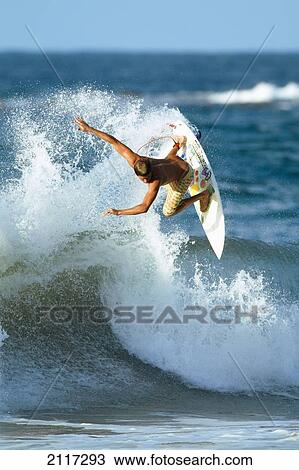 Stock Image - Hawaii, Maui, Kapalua, Professional surfer Albee Layer catches air on a wave. EDITORIAL USE ONLY.. Fotosearch