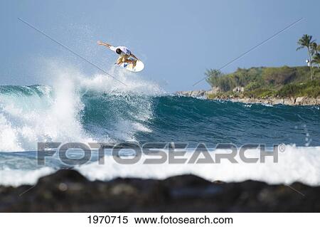 Hawaii, Maui, Kapalua, Professional Surfer Albee Layer Catches Air Off A Wave. For Editorial Use Only. View Large Photo Image Stock Photography - Hawaii, Maui, Kapalua, Professional Surfer Albee Layer Catches Air Off A Wave. For Editorial Use Only.. Fotosearch