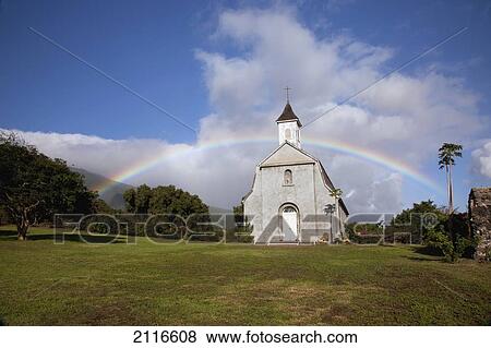 Stock Photo - Hawaii, Maui, Kaupo, A rainbow forms over St. Josephs Church.. Fotosearch