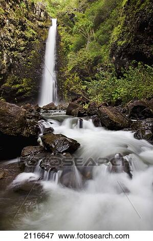 Stock Photo - Hawaii, Maui, Kaupo, A sunny view of Alalele Falls.. Fotosearch