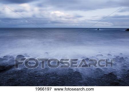 Hawaii, Maui, Kaupo, Rocky Ocean Shoreline At Evening, Long Exposure. View Large Photo Image Stock Photo - Hawaii, Maui, Kaupo, Rocky Ocean Shoreline At Evening, Long Exposure.. Fotosearch