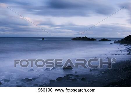Stock Photo - Hawaii, Maui, Kaupo, Rocky Ocean Shoreline At Evening, Long Exposure.. Fotosearch