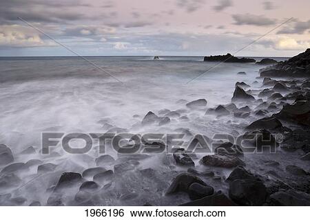 Stock Photograph - Hawaii, Maui, Kaupo, Rocky Ocean Shoreline At Evening, Long Exposure.. Fotosearch