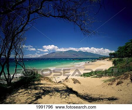 Stock Photograph - Hawaii, Maui, Kihei, Kamaole Beach, White Capped Water With Island In Distance. Fotosearch