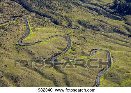 Stock Image - Hawaii, Maui, Kula aerial view of serpentine switchbacks of the Haleakala Highway. Fotosearch
