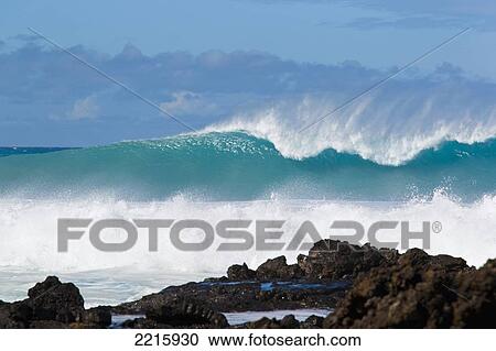 Stock Image - Hawaii, Maui, Laperouse, Beautiful blue ocean wave.. Fotosearch