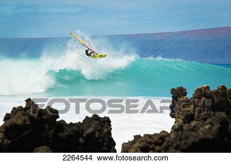 Picture - Hawaii, Maui, Laperouse, Professional Windsurfer Kail Lenny Riding A Large Wave At Laperouse Bay.. Fotosearch