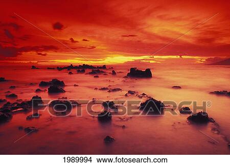 Picture - Hawaii, Maui, Lava Rock Beach At Sunset With Dramatic Red Yellow Sky And Shore. Fotosearch