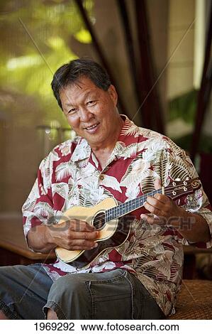 Hawaii, Maui, Local Male Playing An Ukulele. View Large Photo Image Stock Image - Hawaii, Maui, Local Male Playing An Ukulele.. Fotosearch
