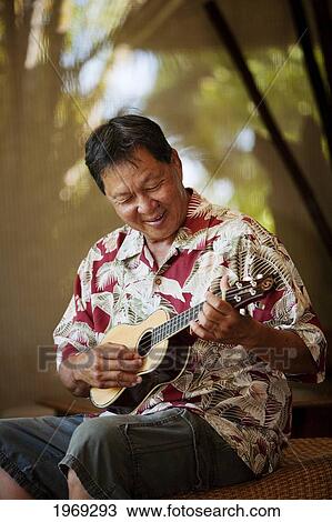 Hawaii, Maui, Local Male Playing An Ukulele. View Large Photo Image Stock Image - Hawaii, Maui, Local Male Playing An Ukulele.. Fotosearch