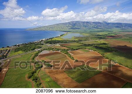Stock Photograph - Hawaii, Maui, Maalaea Bay, aerial of coast and North Kihei in the background. Fotosearch