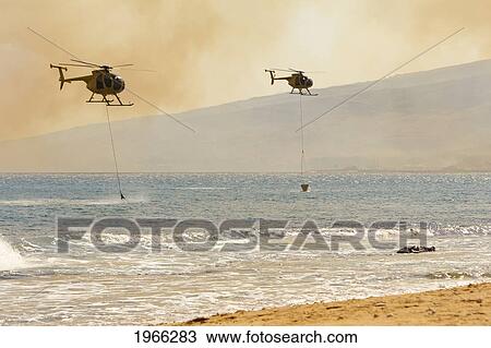 Hawaii, Maui, Ma'alaea, Fire Helicopters Collecting Ocean Water To Help Put Out Wildfire. Editorial Use Only. View Large Photo Image Stock Image - Hawaii, Maui, Ma'alaea, Fire Helicopters Collecting Ocean Water To Help Put Out Wildfire. Editorial Use Only.. Fotosearch