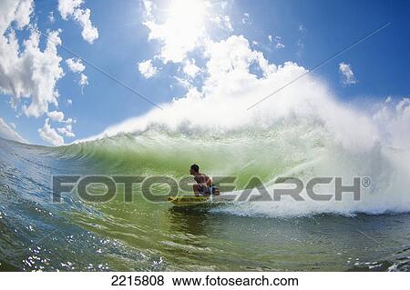 Hawaii, Maui, Maalaea, Professional Surfer Patri McLaughlin rides a wave at legendary surf break know as Freight Trains. View Large Photo Image Stock Photo - Hawaii, Maui, Maalaea, Professional Surfer Patri McLaughlin rides a wave at legendary surf break know as Freight Trains.. Fotosearch