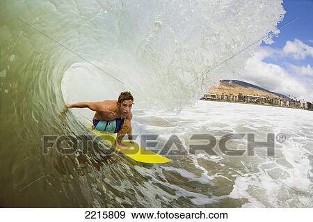 Hawaii, Maui, Maalaea, Professional Surfer Patri McLaughlin rides a wave at legendary surf break know as Freight Trains. View Large Photo Image Stock Photo - Hawaii, Maui, Maalaea, Professional Surfer Patri McLaughlin rides a wave at legendary surf break know as Freight Trains.. Fotosearch