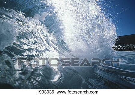 Hawaii, Maui, Maalaea, Shimmering Wave Viewed From Inside, Crashing Against Breakwall. View Large Photo Image Stock Photograph - Hawaii, Maui, Maalaea, Shimmering Wave Viewed From Inside, Crashing Against Breakwall.. Fotosearch
