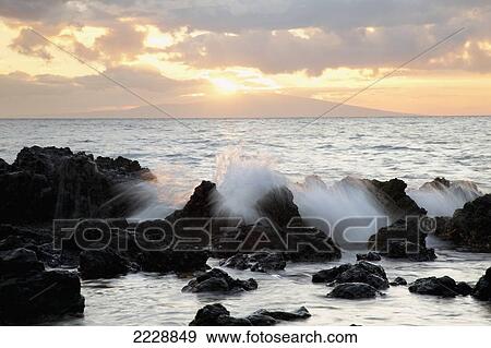 Stock Photo - Hawaii, Maui, Makena, A Sunset View At Big Beach With Soft Wave Crash.. Fotosearch