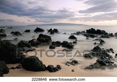 Stock Photograph - Hawaii, Maui, Makena, A Sunset View At Big Beach With Soft Water. Fotosearch