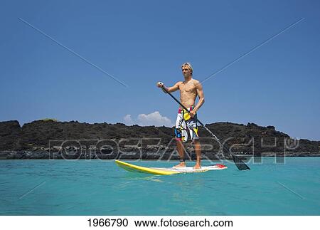 Hawaii, Maui, Makena, Athletic Stand Up Paddle Surfer In Ocean View Large Photo Image Stock Image - Hawaii, Maui, Makena, Athletic Stand Up Paddle Surfer In Ocean. Fotosearch