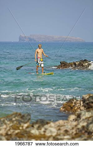 Hawaii, Maui, Makena, Athletic Stand Up Paddle Surfer In Ocean View Large Photo Image Stock Photo - Hawaii, Maui, Makena, Athletic Stand Up Paddle Surfer In Ocean. Fotosearch
