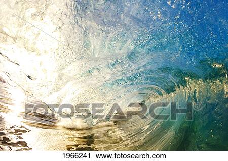 Stock Image - Hawaii, Maui, Makena, Barrel Of Beautiful Wave, Sunrise Light.. Fotosearch