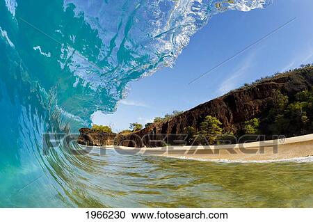 Stock Image - Hawaii, Maui, Makena Beach, Beautiful Wave Breaking Along Shore.. Fotosearch