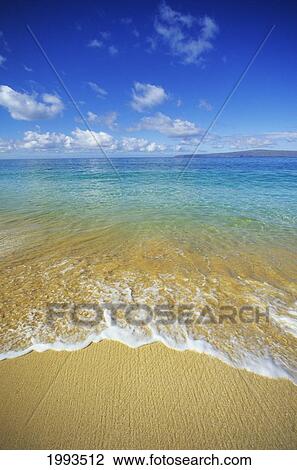 Stock Image - Hawaii, Maui, Makena Beach, Closeup Of Textured Foamy Shoreline, Calm Turquoise Ocean.. Fotosearch