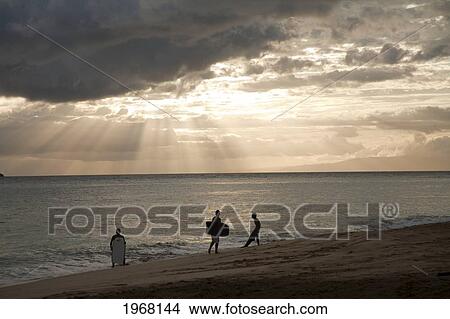Hawaii, Maui, Makena Beach, Sunsets With Boogie Boarders On The Beach. View Large Photo Image Picture - Hawaii, Maui, Makena Beach, Sunsets With Boogie Boarders On The Beach.. Fotosearch