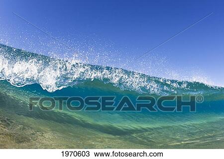 Stock Image - Hawaii, Maui, Makena Beach, Tip Of A Breaking Wave.. Fotosearch