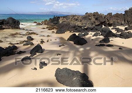 Stock Image - Hawaii, Maui, Makena, Beautiful clear ocean among lava rock.. Fotosearch