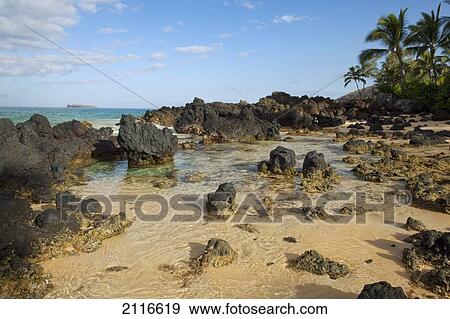 Stock Photo - Hawaii, Maui, Makena, Beautiful clear ocean among lava rock.. Fotosearch