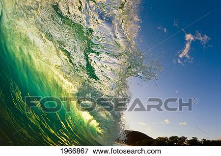Stock Photo - Hawaii, Maui, Makena, Beautiful Wave At Sunset, View From Inside The Barrel. Fotosearch