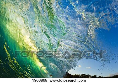 Stock Photo - Hawaii, Maui, Makena, Beautiful Wave At Sunset, View From Inside The Barrel. Fotosearch