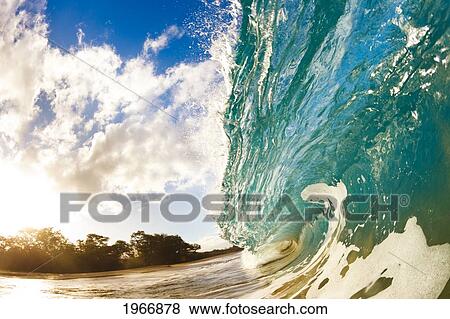 Stock Photo - Hawaii, Maui, Makena, Beautiful Wave At Sunset, View From Inside The Barrel. Fotosearch