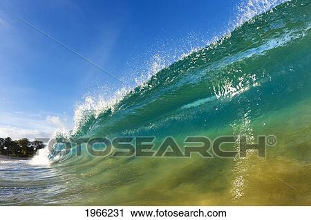 Stock Image - Hawaii, Maui, Makena, Beautiful Wave Breaking Along Shore.. Fotosearch