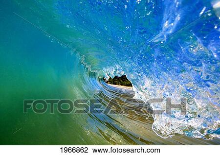 Stock Image - Hawaii, Maui, Makena, Beautiful Wave Breaking, View From Inside The Barrel. Fotosearch