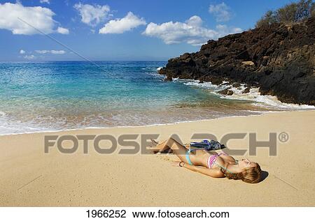 Hawaii, Maui, Makena - Big Beach, Beautiful Woman With Snorkel Gear Relaxing On Sandy Shore. View Large Photo Image Stock Image - Hawaii, Maui, Makena - Big Beach, Beautiful Woman With Snorkel Gear Relaxing On Sandy Shore.. Fotosearch