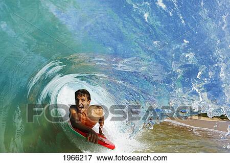 Hawaii, Maui, Makena - Big Beach, Boogie Boarder Riding Barrel Of Beautiful Wave. View Large Photo Image Stock Photo - Hawaii, Maui, Makena - Big Beach, Boogie Boarder Riding Barrel Of Beautiful Wave.. Fotosearch